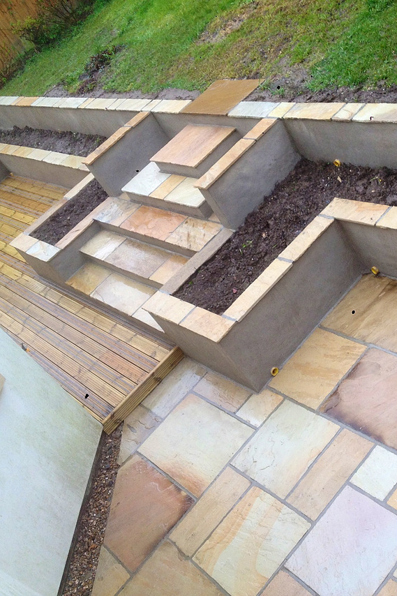 work in progress stylish materials used to create terraced garden in Teignmouth by Seriously Good Landscapes