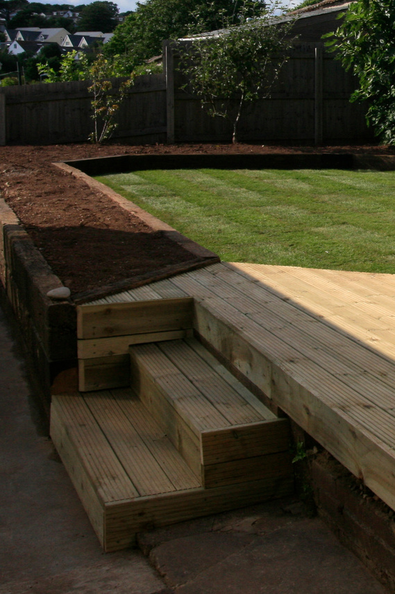 Garden landscaping using decking and lawn in Chirstow Devon, design and build by Seriously Good Landscapes Devon