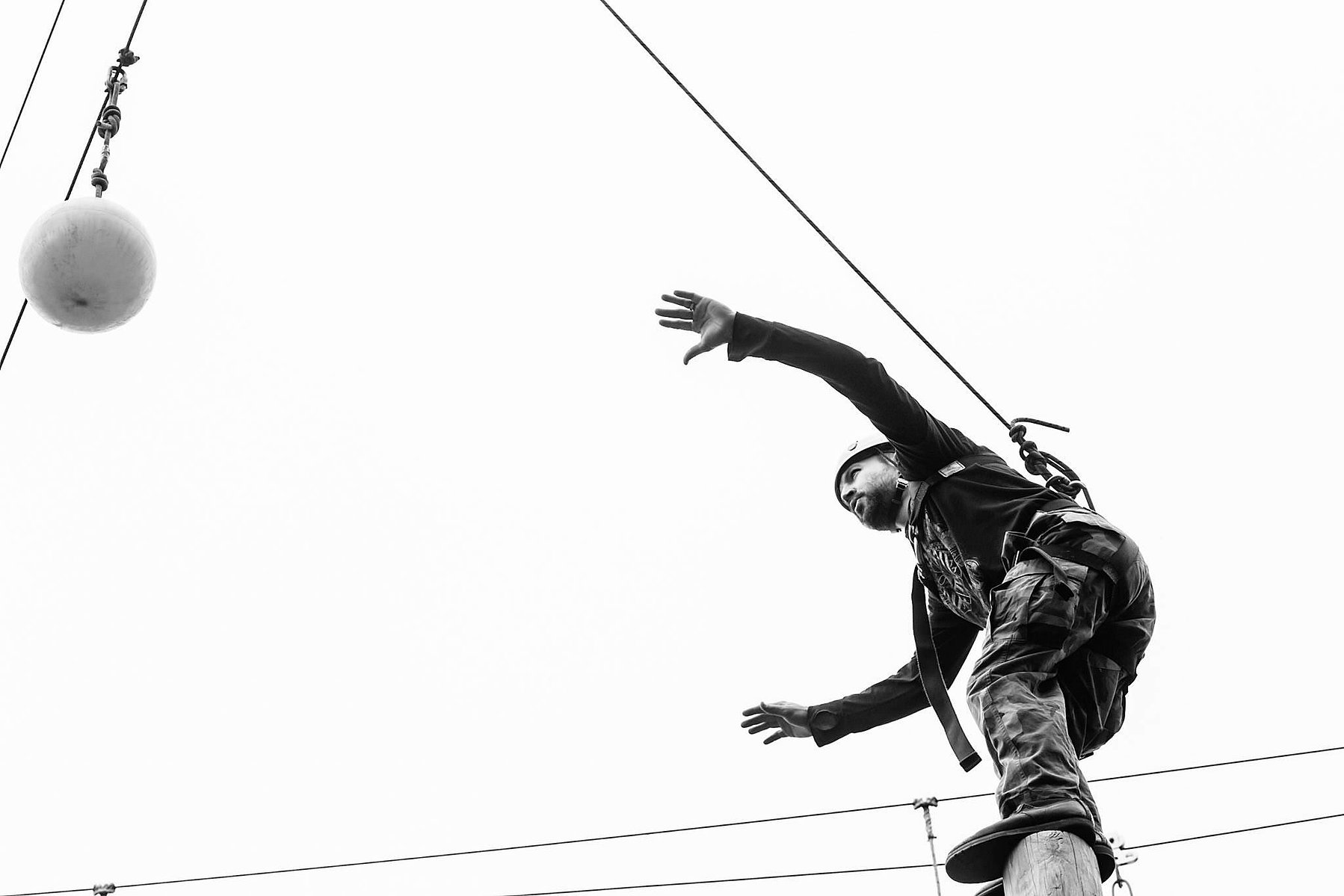 The pole sways wildly as Nick gains his balance.