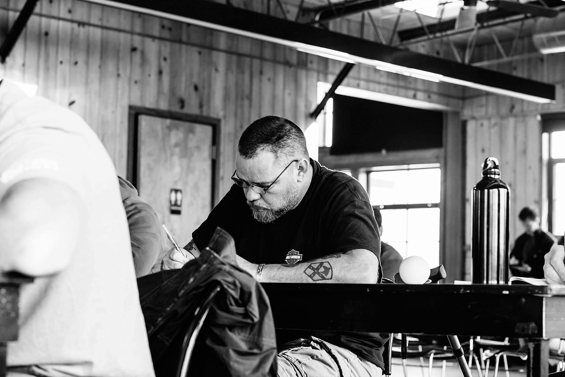 Bill W., an Iraq War Veteran who was wounded in action, takes notes on how trauma affects the brain.