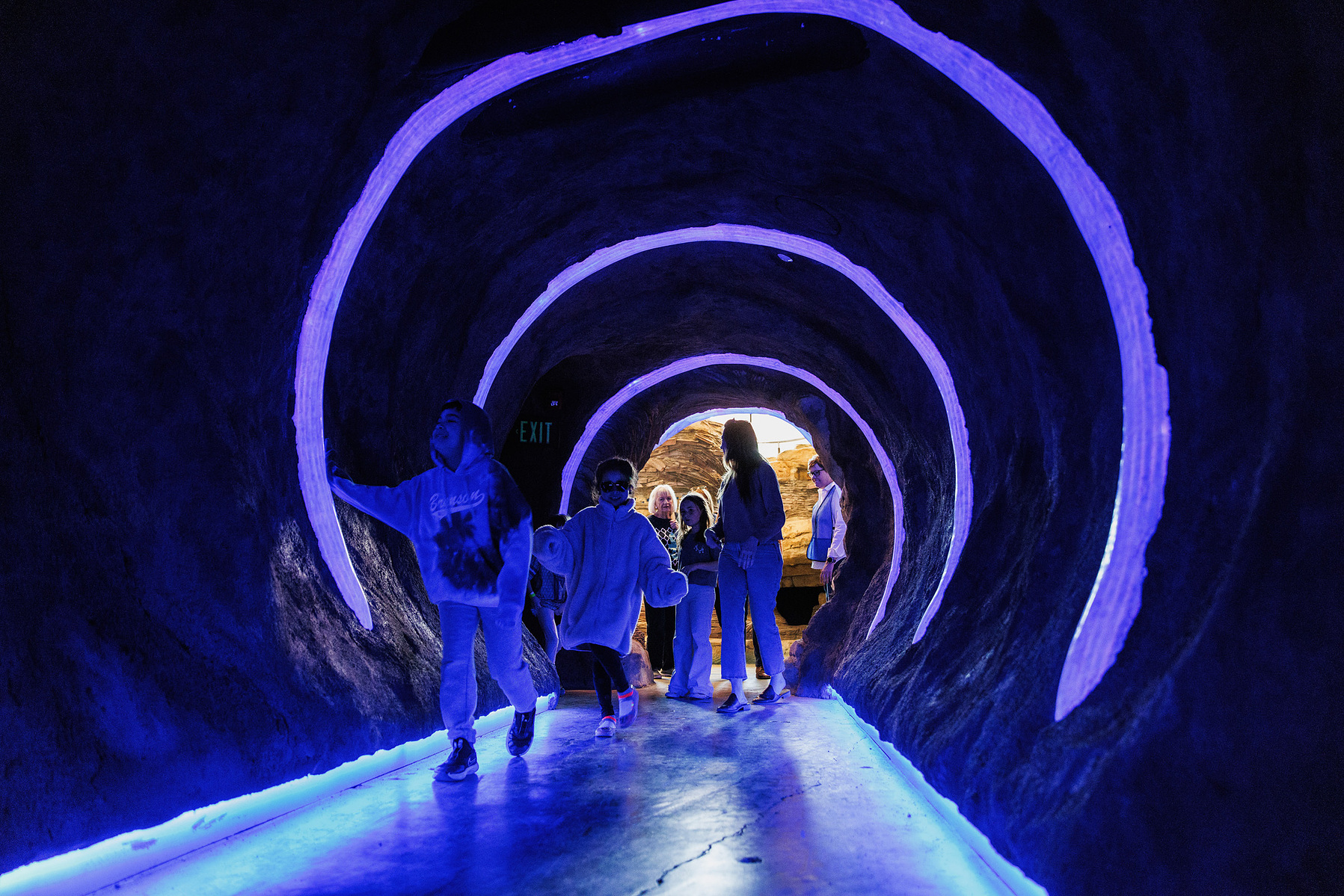 KANSAS CITY, MO – MARCH 16, 2024: Families explore the tunnel entrance at The Rabbit Hole in Kansas City, Missouri. Guest enter and travel through a tunnel emerging in the museum filled with scenes from children’s books. Credit: Chase Castor for The New Y