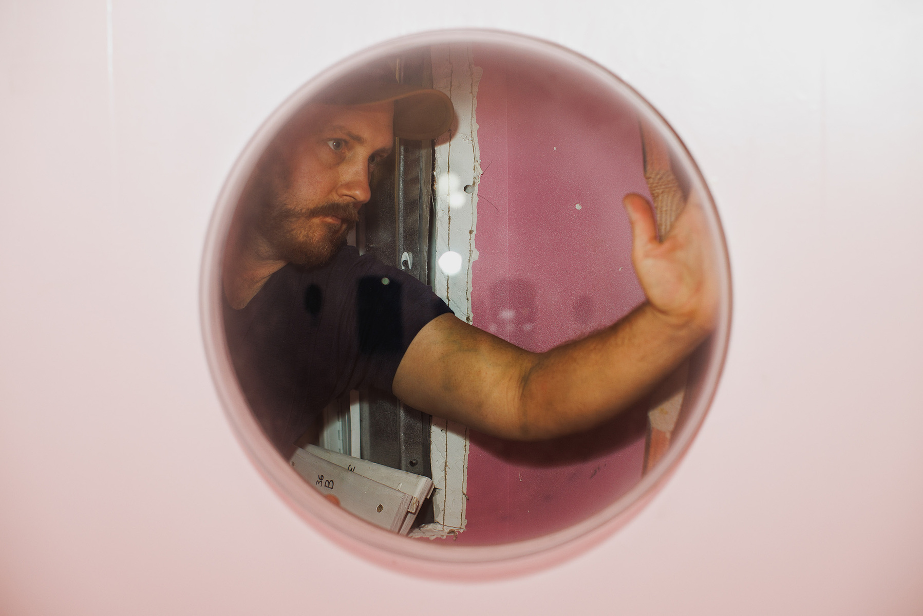 KANSAS CITY, MO – DECEMBER 07, 2023: Will Burnip installs a clear dome in a space dedicated to Russell and Lillian Hoban’s “Frances” series at The Rabbit Hole; an immersive museum in Kansas City, MO where people can experience scenes and characters from c