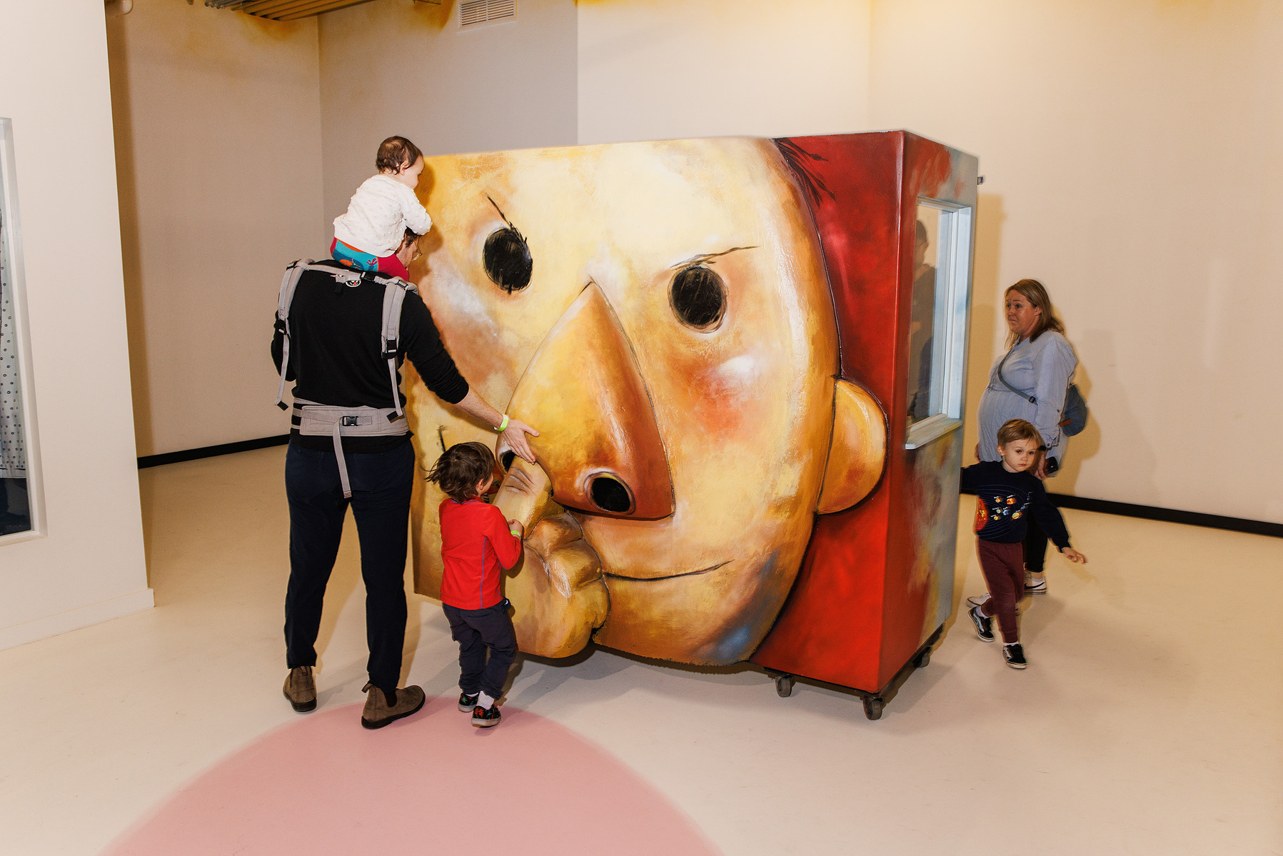 KANSAS CITY, MO – MARCH 16, 2024: A family helps David pick his nose at The Rabbit Hole in Kansas City, Missouri. The piece is from David Shannon’s No, David! picture book. Credit: Chase Castor for The New York Times.
