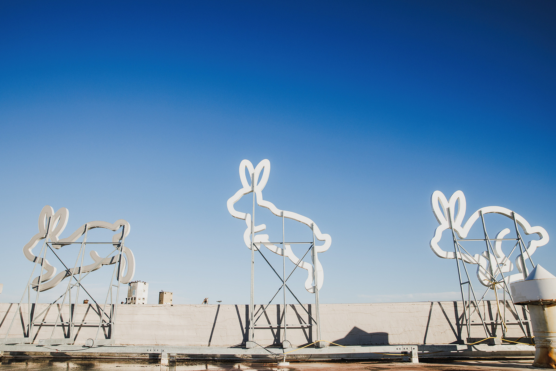 KANSAS CITY, MO – DECEMBER 07, 2023: One of the giant light up rabbits that “run” across the roof of The Rabbit Hole; an immersive museum in Kansas City, MO where people can experience scenes and characters from children’s literature. Credit: Chase Castor