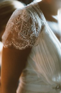 Intricate lace sleeves on a Boston Wedding gown