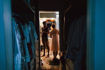 Bridesmaids check their makeup during wedding preparations.