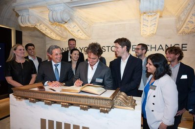 Company executive signs the NYSE book