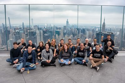 Company's employees celebrate IPO at NYC the Edge with the city view and cityscape behind them