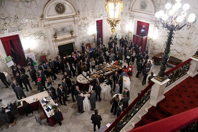 top angle of the room at the president's club company annual conference during the break when guests are networking