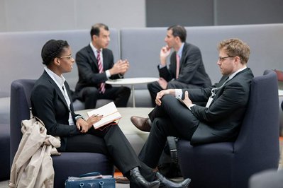 guests of company's annual conference conversing and networking during a break 