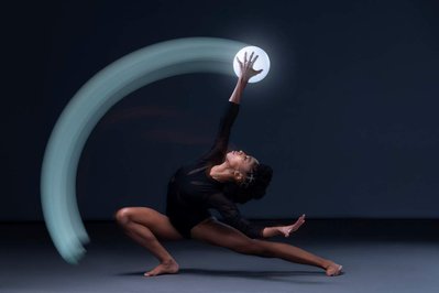 Dancer Jamaris Mitchell dancing with an orb in long exposure