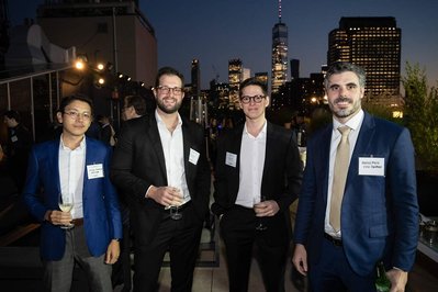 attendees of a company event in NYC posing to the camera