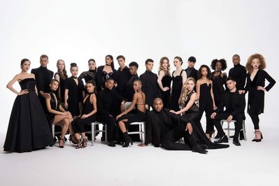 Studio group portrait of the Ailey School dancers wearing black