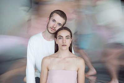 portrait of Mark Sampson and Taylor Johnson for the Juilliard dance calendar 2016 with dancers running in the background in long exposure