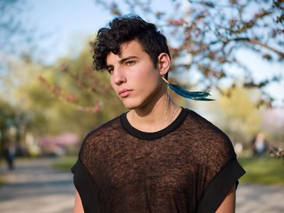 portrait of androgenous guy at the park 