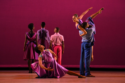 a colorful scene with several dancers dancing on stage with a pink background