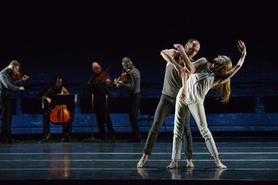 male and female dancers dancing with a string quartet in the background