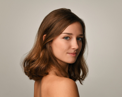 Headshot of a dancer on a white background at the Ailey School