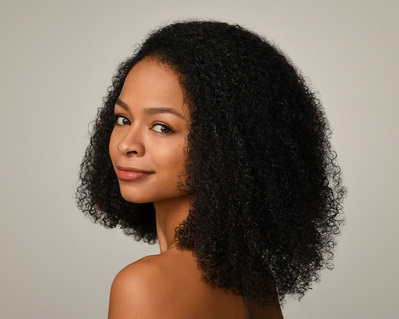 Headshot of a dancer on a white background at the Ailey School