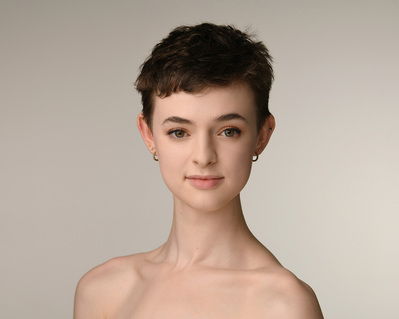 Headshot of a dancer on a white background at the Ailey School