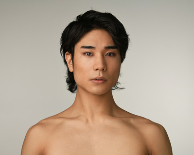 Headshot of a dancer on a white background at the Ailey School