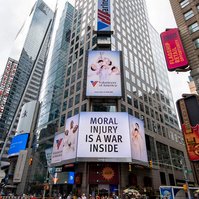 The Volunteers of America campaign photographed by Nir Arieli on Times Square's routers building, NYC during daytime