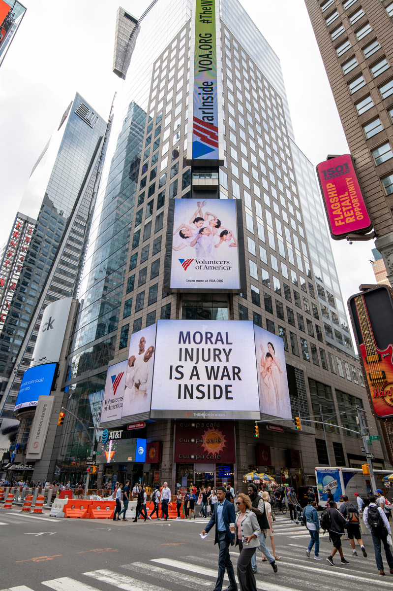 The Volunteers of America campaign photographed by Nir Arieli on Times Square's routers building, NYC during daytime