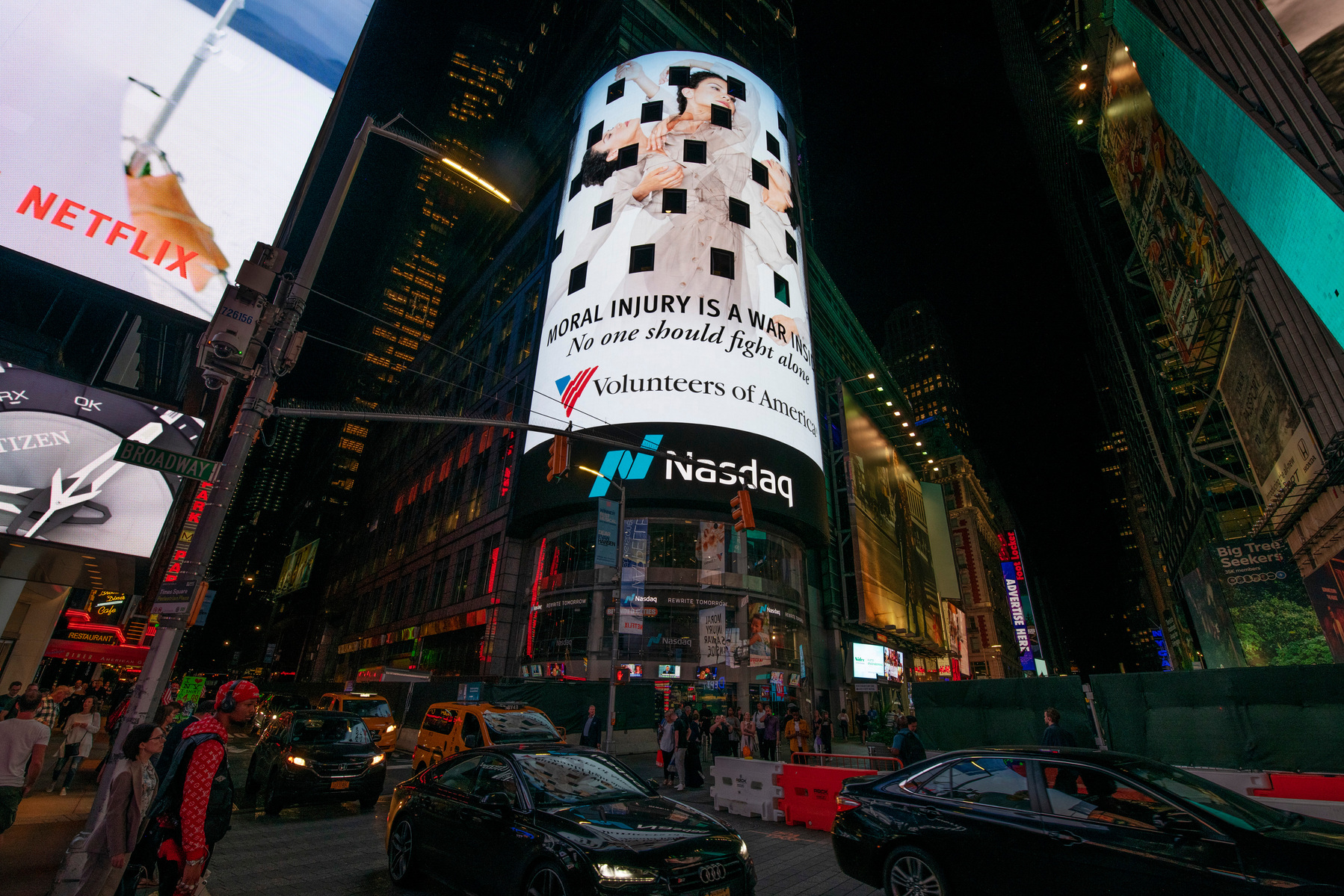 The Volunteers of America campaign photographed by Nir Arieli on Times Square's NASDAQ building, NYC at night