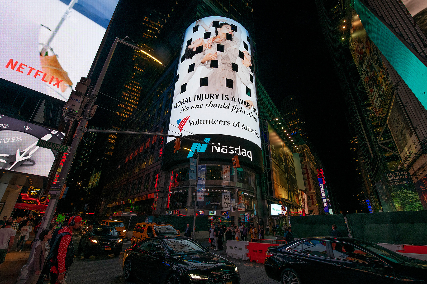 The Volunteers of America campaign photographed by Nir Arieli on Times Square's NASDAQ building, NYC at night
