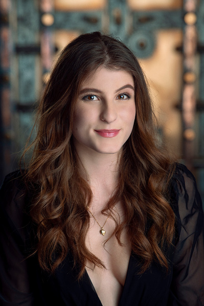 a corporate headshot in a natural environment background