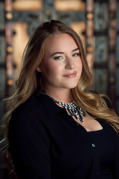 a corporate headshot in a natural environment background