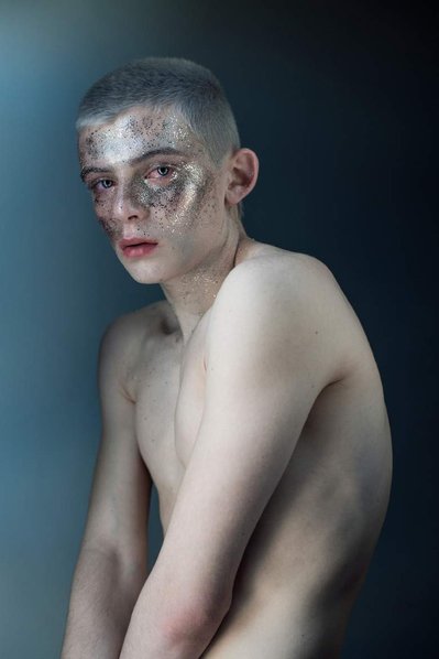 portrait of dancer Ian Sanford with glitter on his face