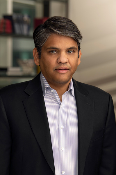 a corporate headshot in a natural environment background