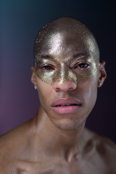 portrait of dancer Charlie Grant with glitter on his face