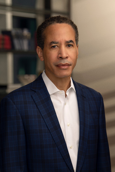 a corporate headshot in a natural environment background