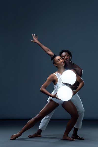 Dancers and couple Hannah Richardson and Amar Smalls dancing with an orb