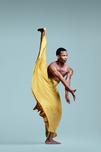male dancer in a yellow skirt at The Ailey School