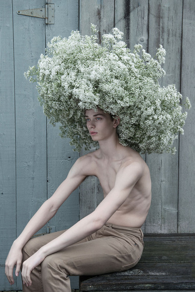 Dancer Joshua Guillemot-Rodgerson in a flower headpiece