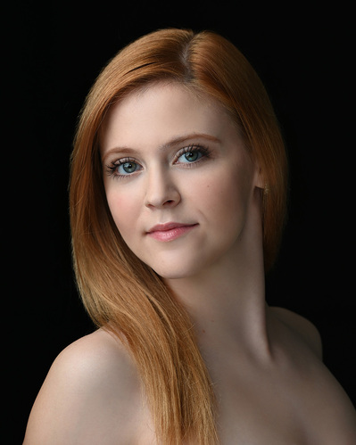 Headshot of a dancer on a black background at the Ailey School