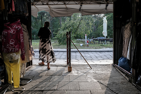 Wiesława closing her clothing stall in Świnoujście, Poland, on 26.09.2023. The stalls, located only a few hundred meters from the German border are a permanent element of the local landscape, selling everything from clothes and handbags to CDs and DVDs to