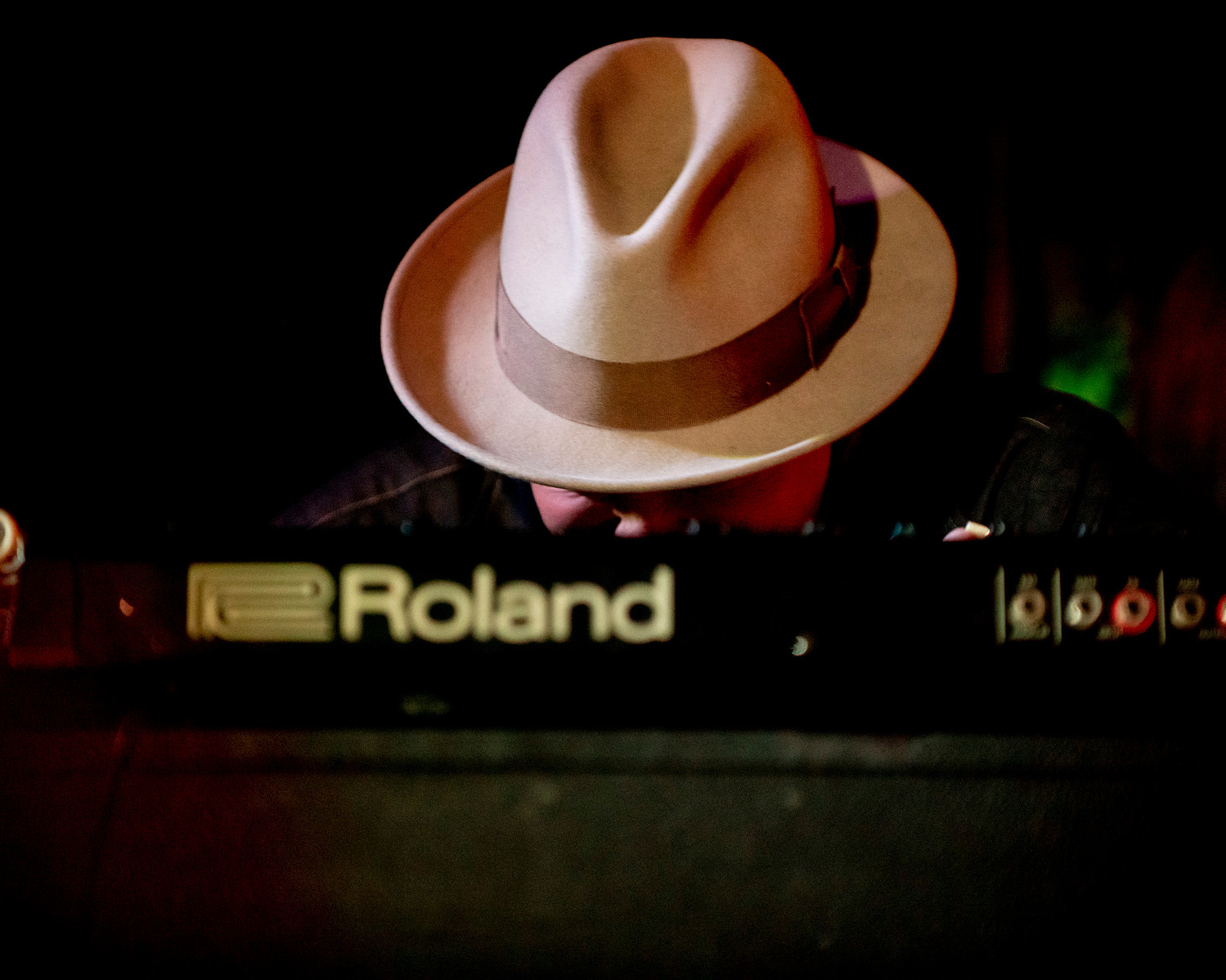keyboarder wearing a hat