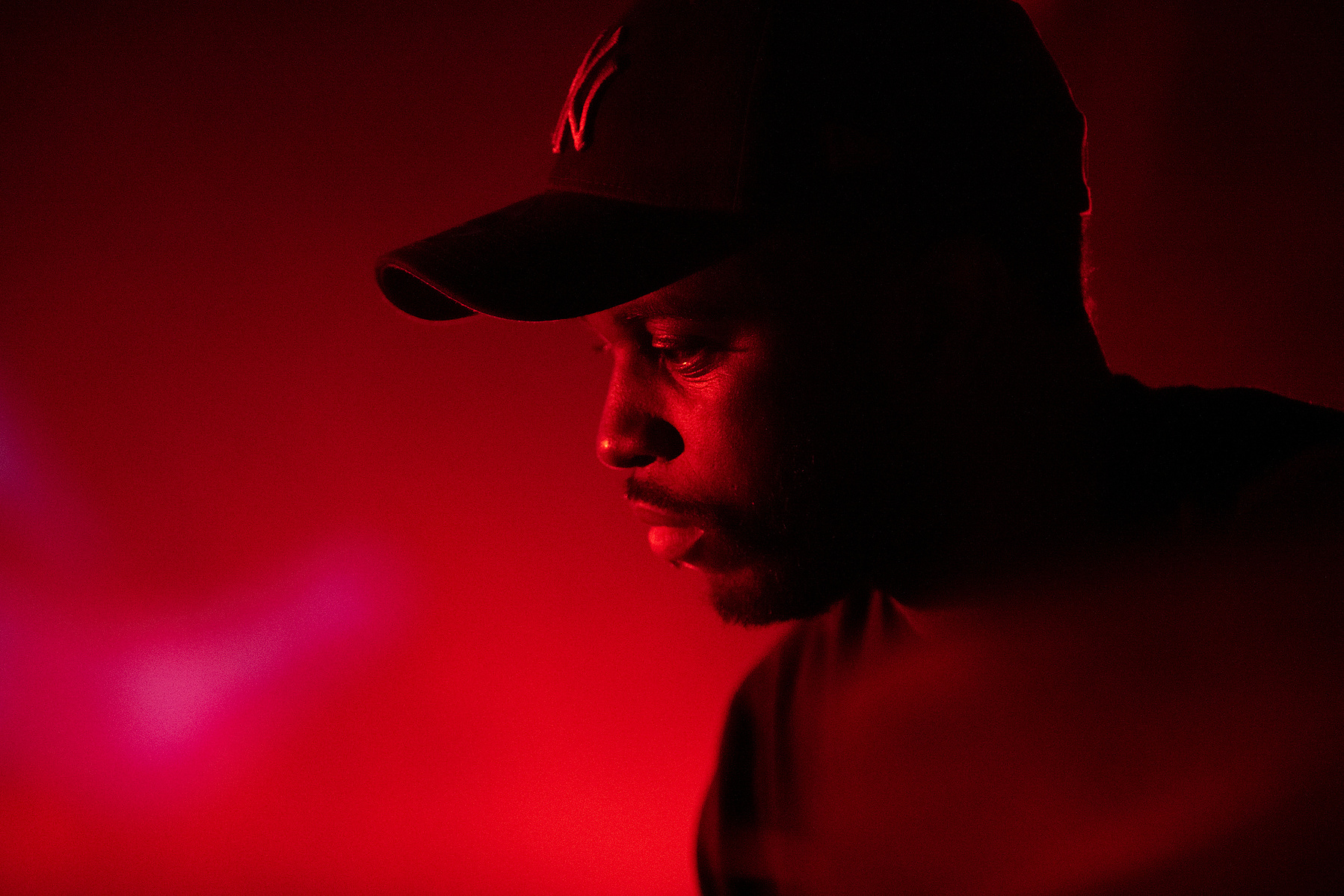 singer keyboarder live on stage in red light