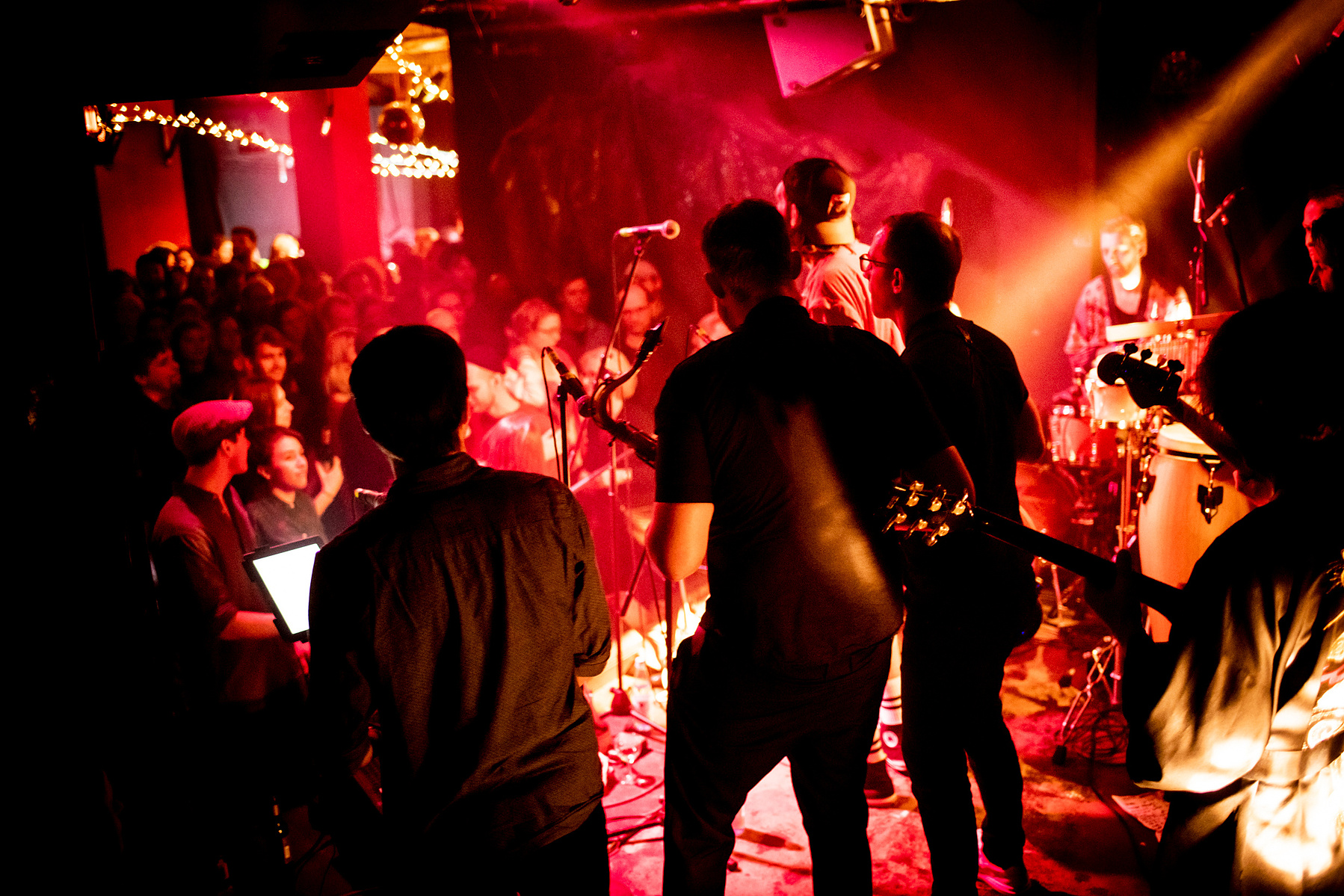 band on stage with audience making party