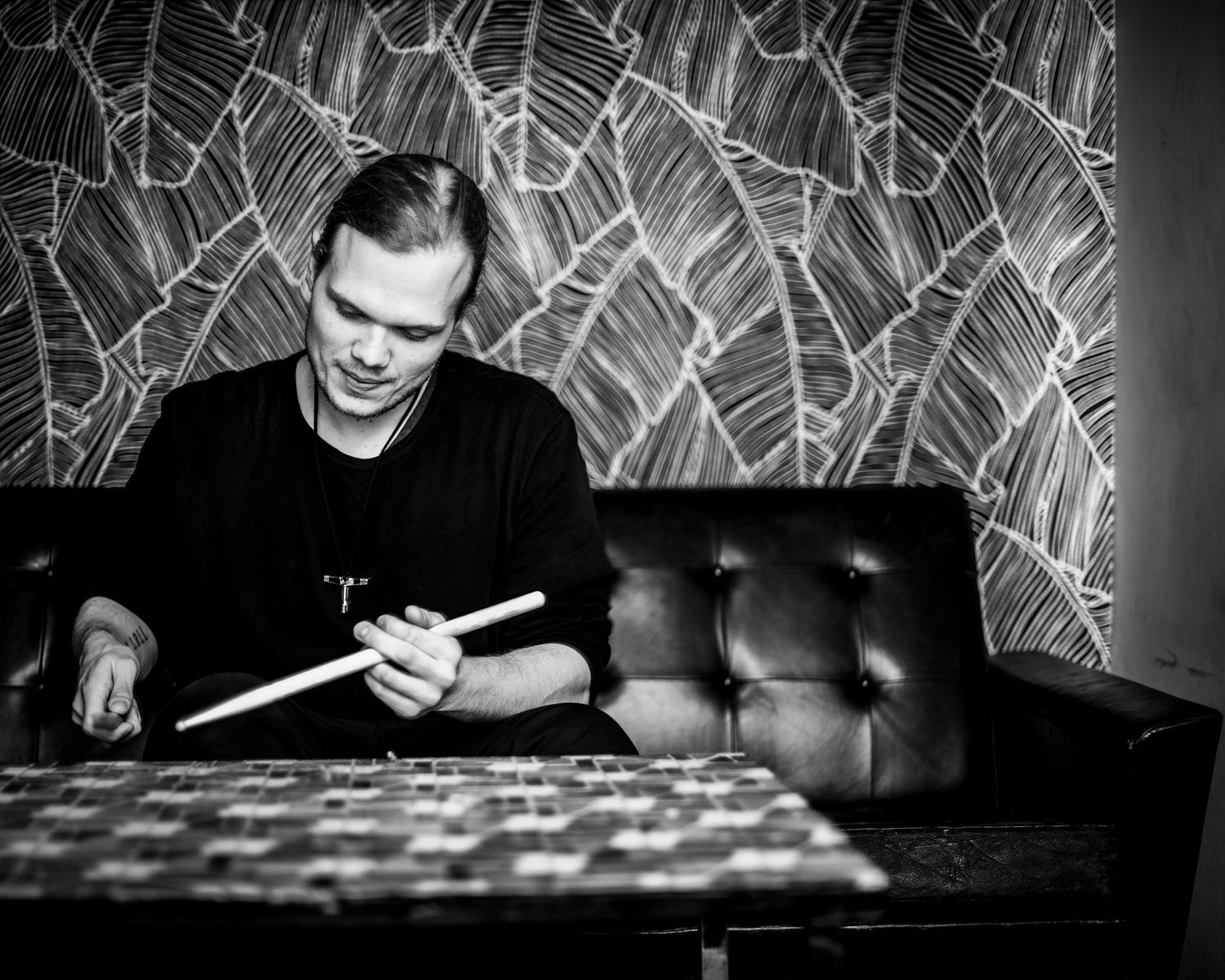drummer drumming with sticks on table