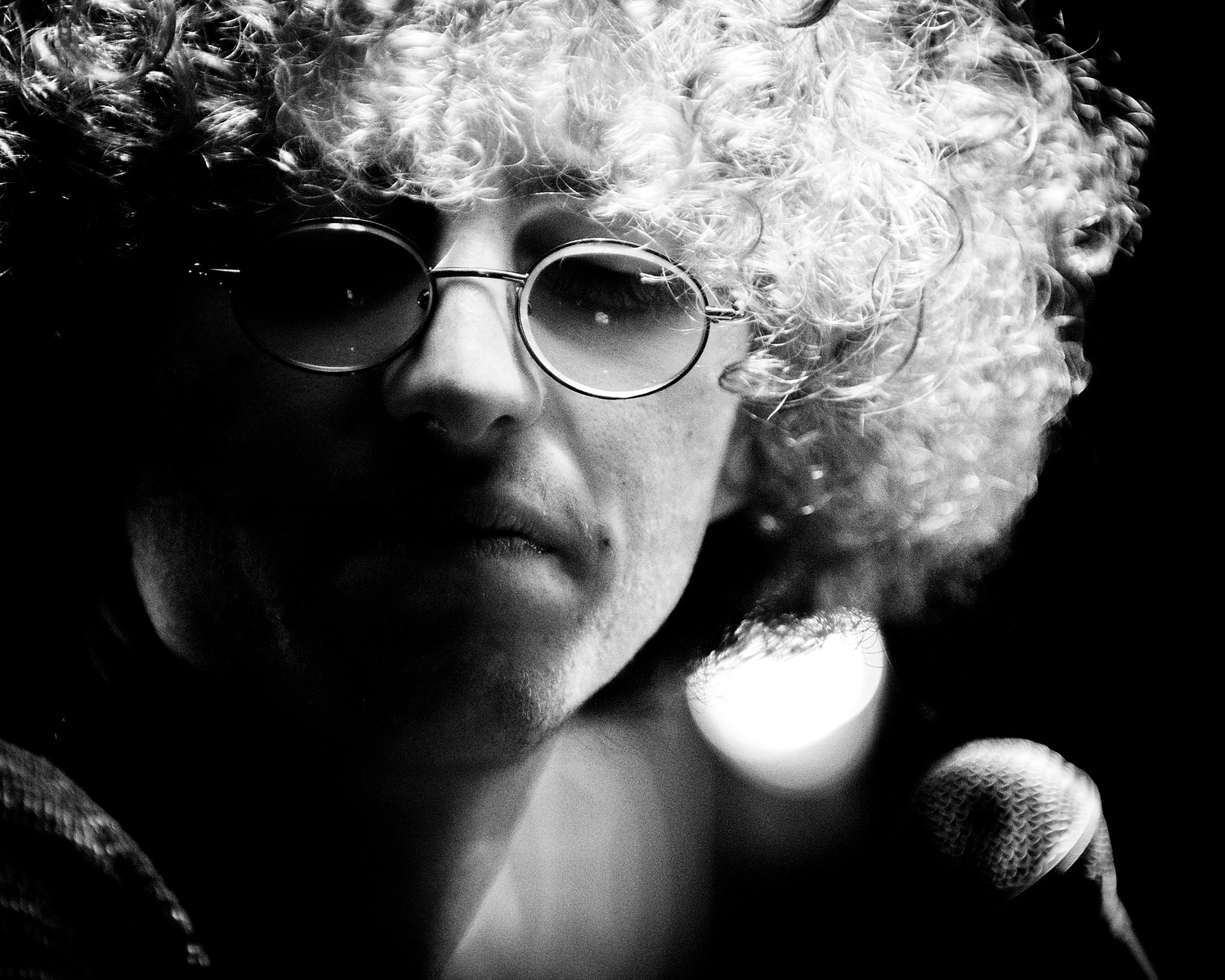 live close up of a jazz singer with curly hair