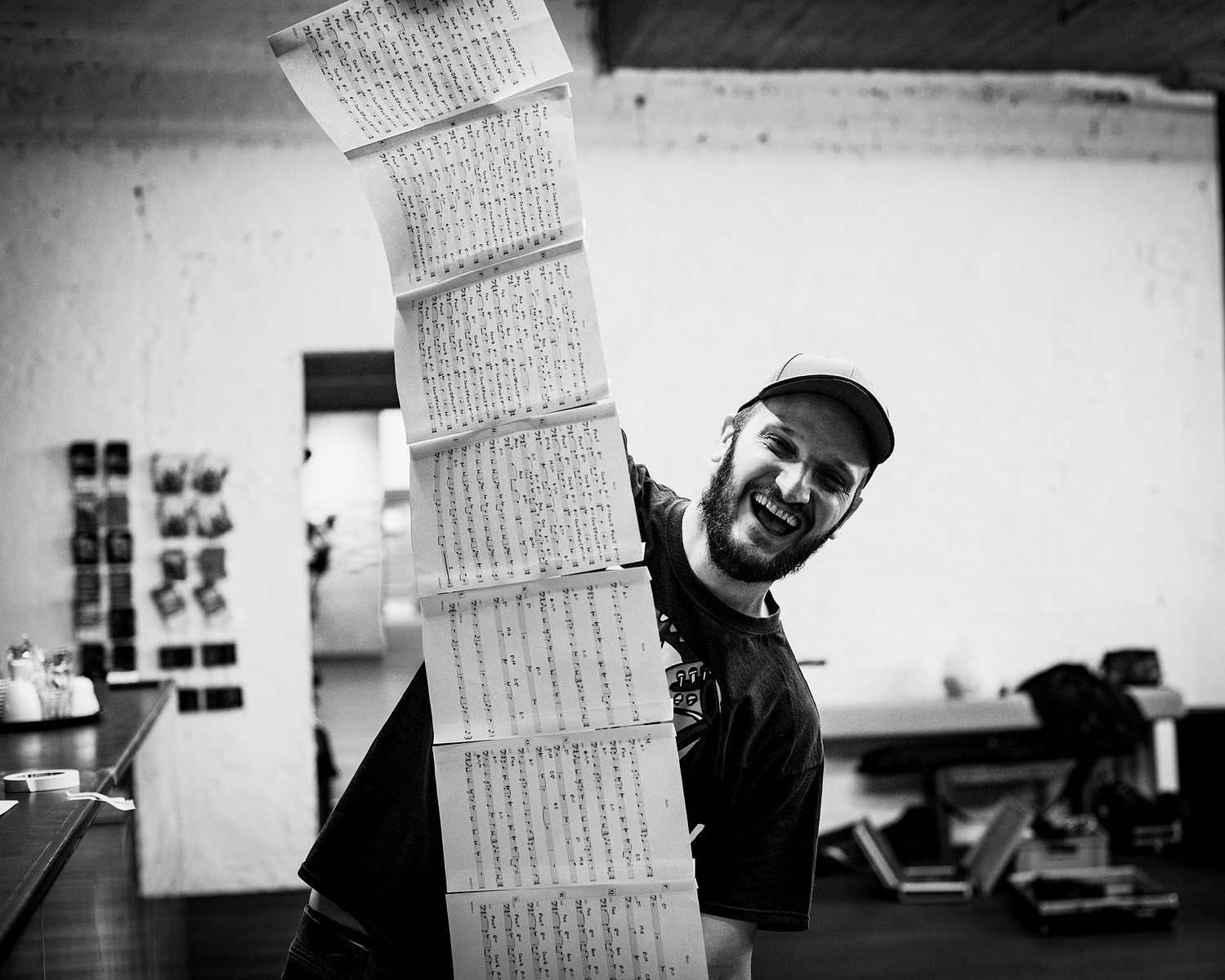 musician holding a very long music sheet