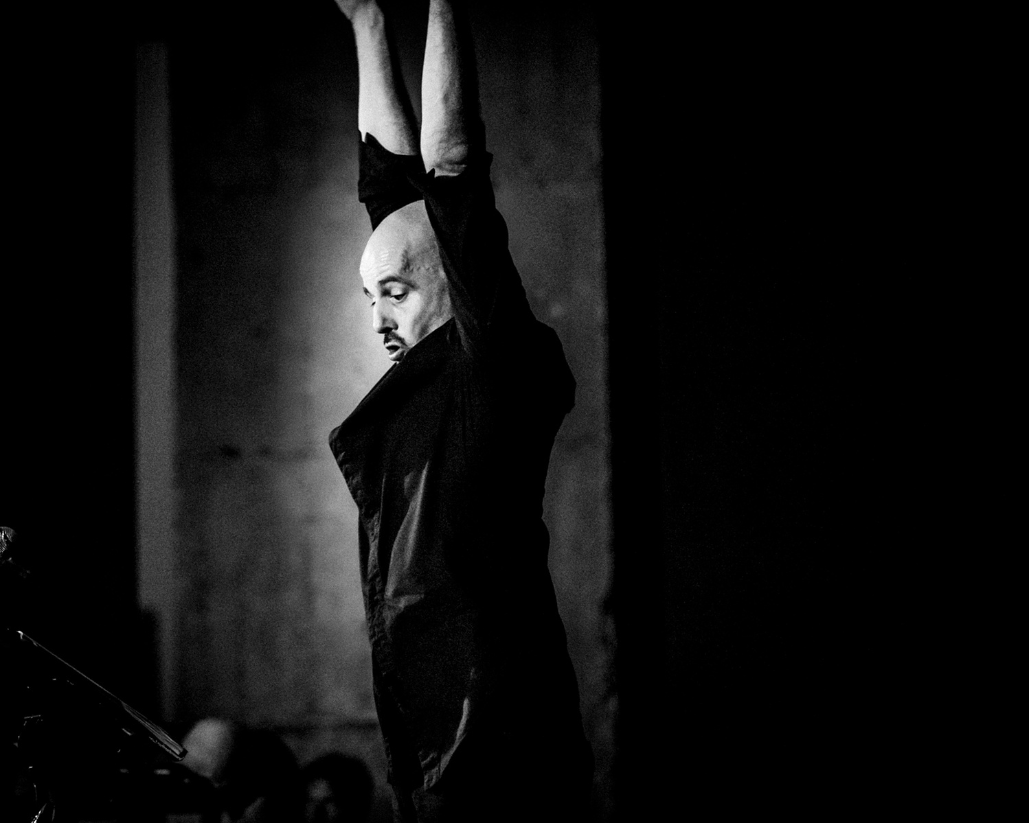 conductor in action arms up high