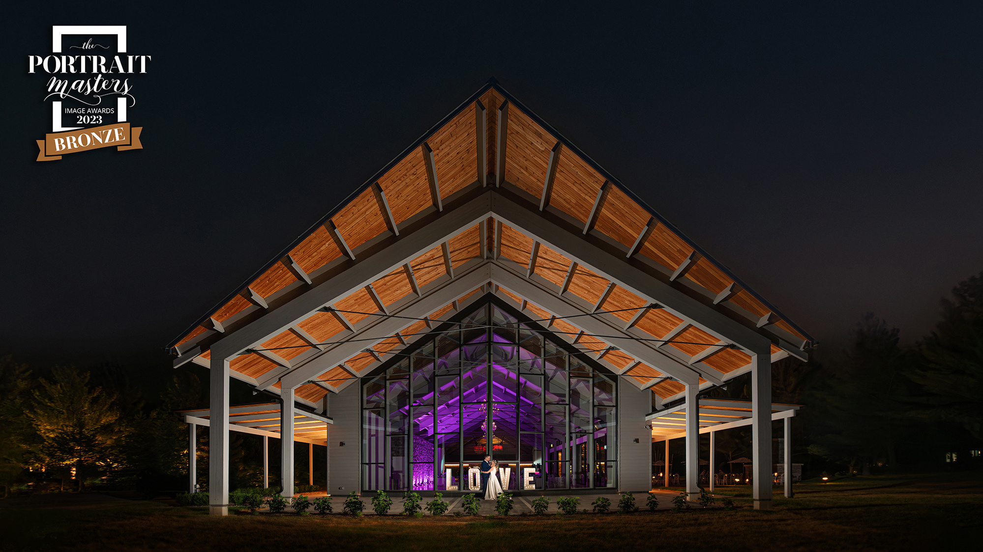 Award-winning wedding photography by Frank Fenn featuring Cara and Jeff at Three Feathers Terrace at night in Innisfil