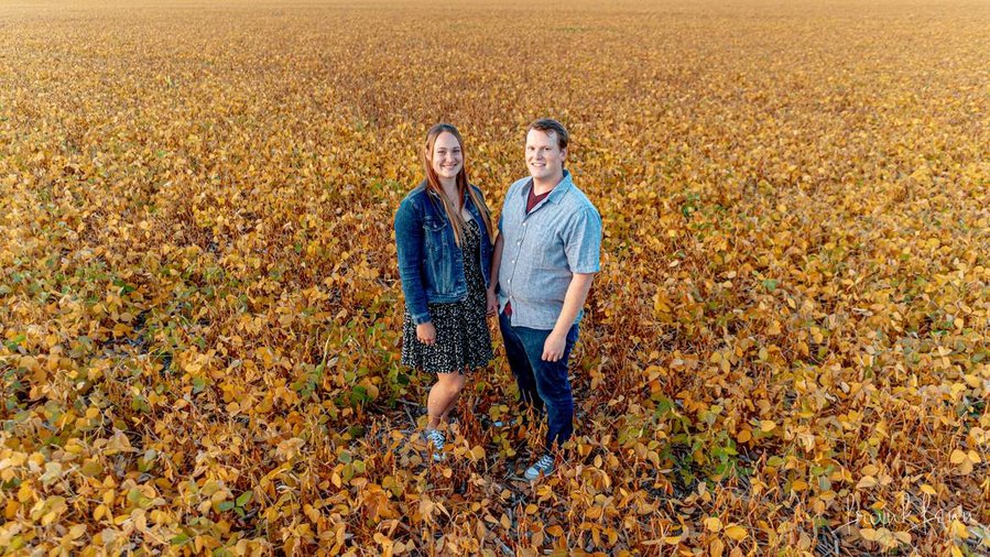Engagement picture in farm field by Ottawa Photographer Frank Fenn