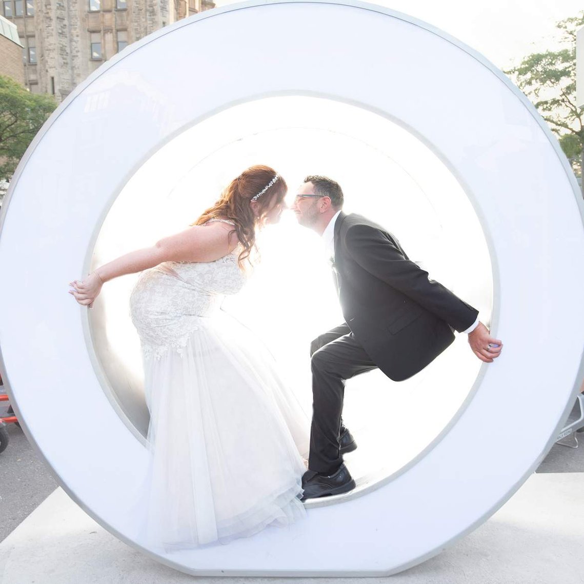 Ottawa wedding photographer image of couple in the Big O in the Byward Market